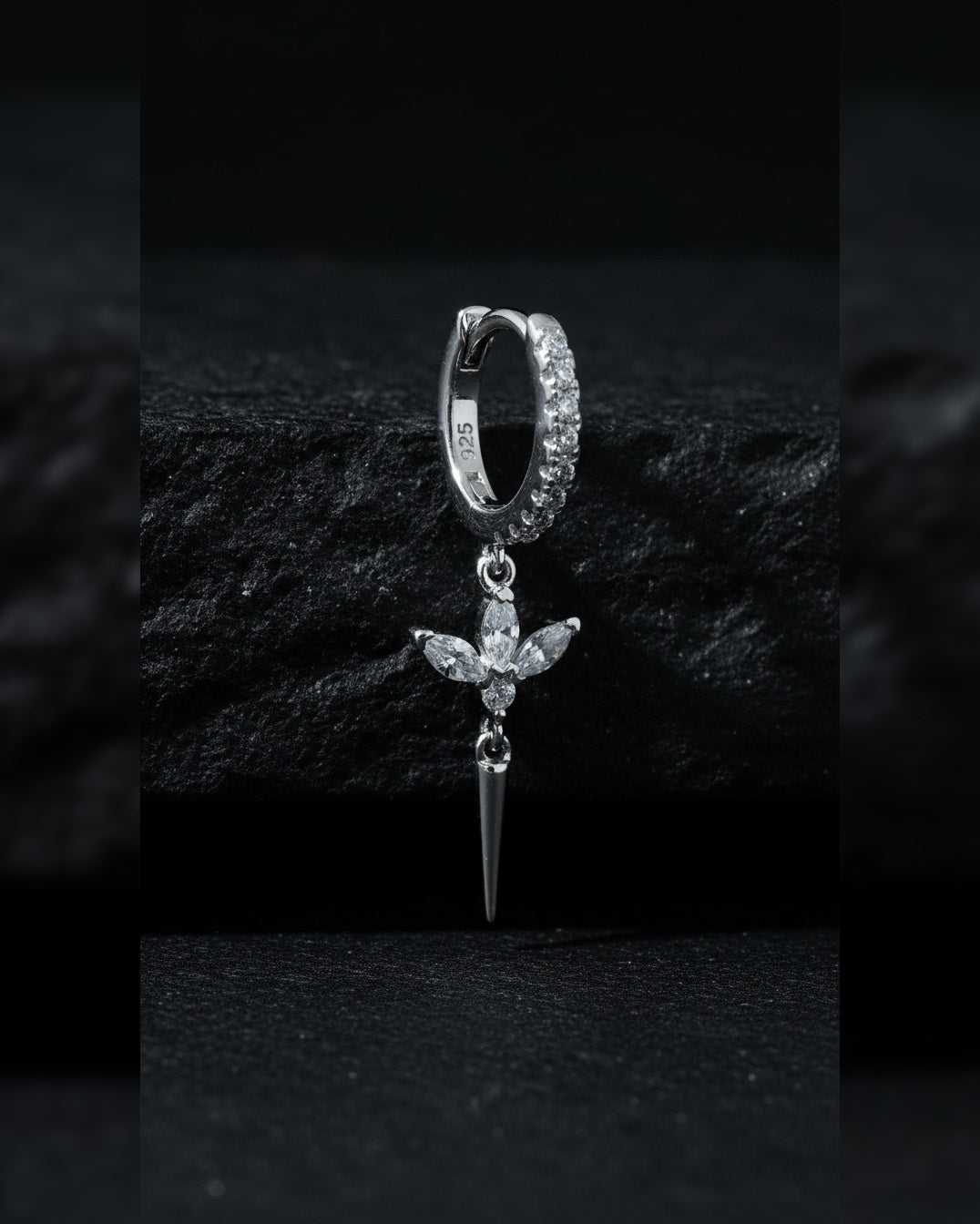 CZ huggie hoop with dangling lotus shape.