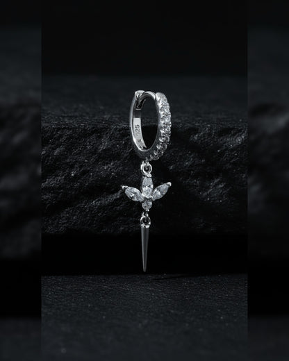 CZ huggie hoop with dangling lotus shape.