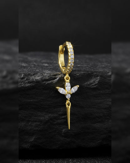 CZ huggie hoop with dangling lotus shape.