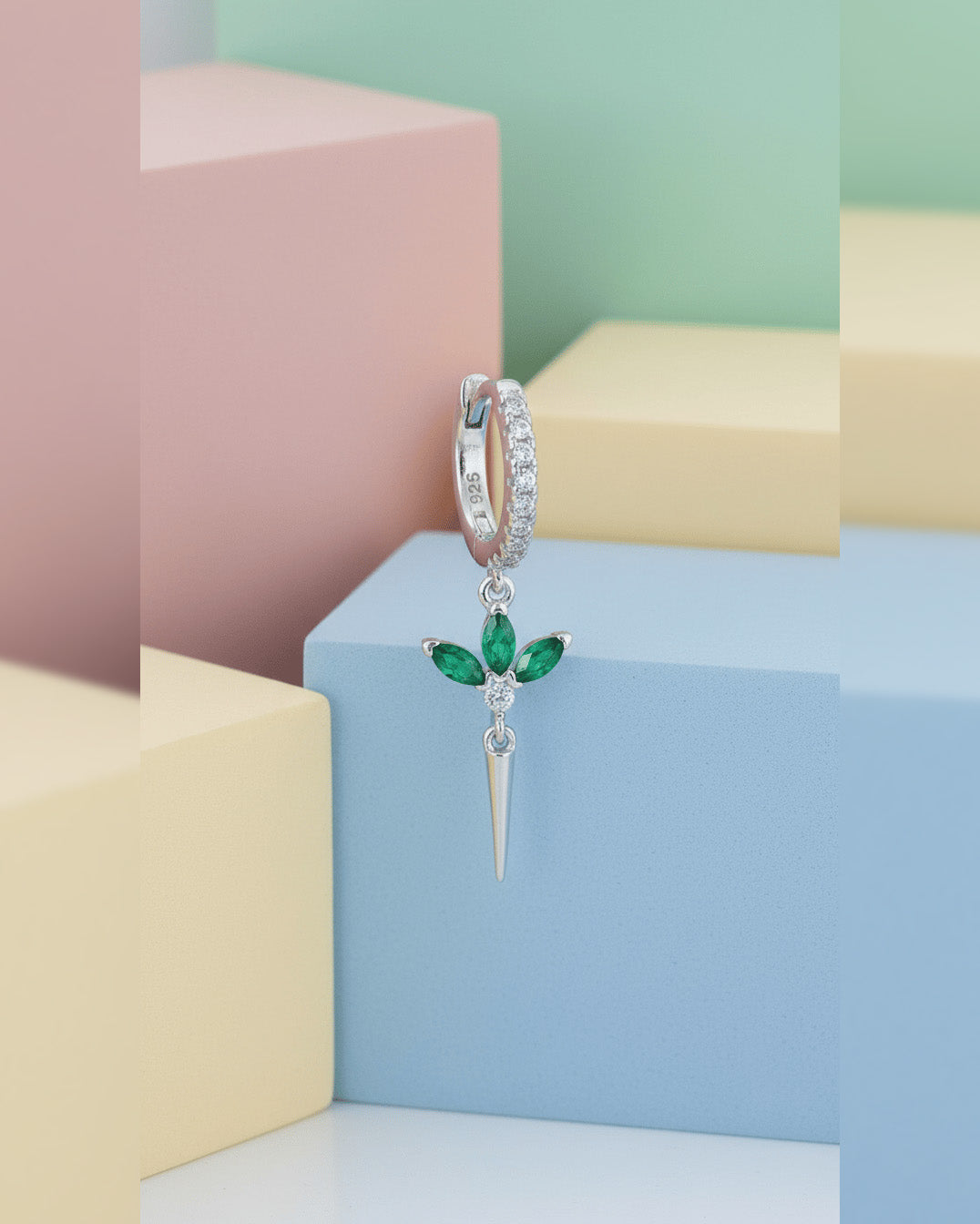 CZ huggie hoop with dangling lotus shape.