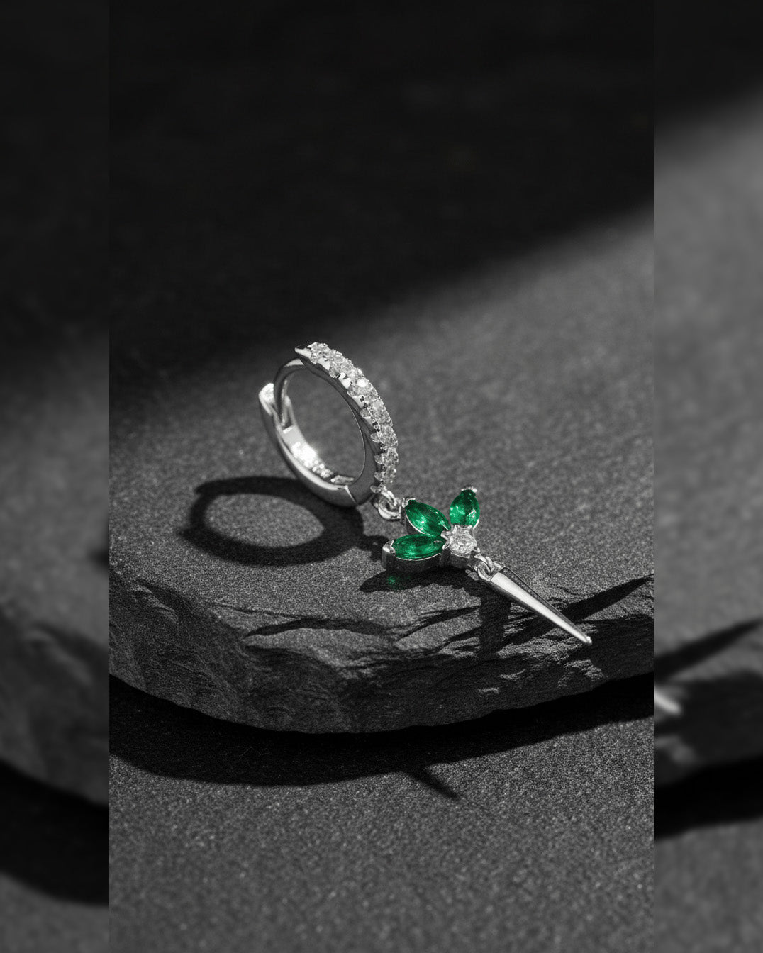 CZ huggie hoop with dangling lotus shape.
