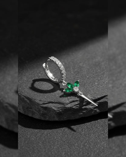 CZ huggie hoop with dangling lotus shape.