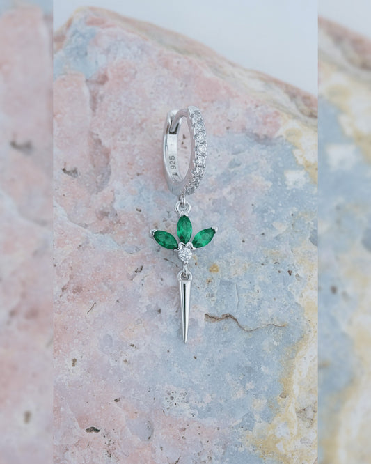 CZ huggie hoop with dangling lotus shape.