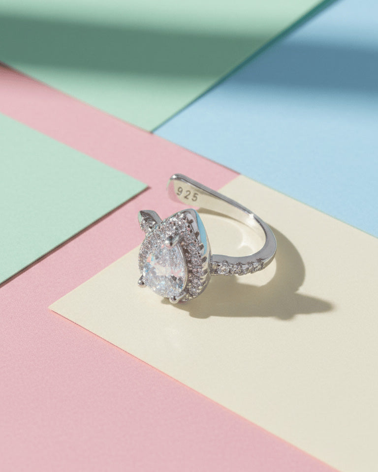 Pear shape CZ in halo setting earcuff.