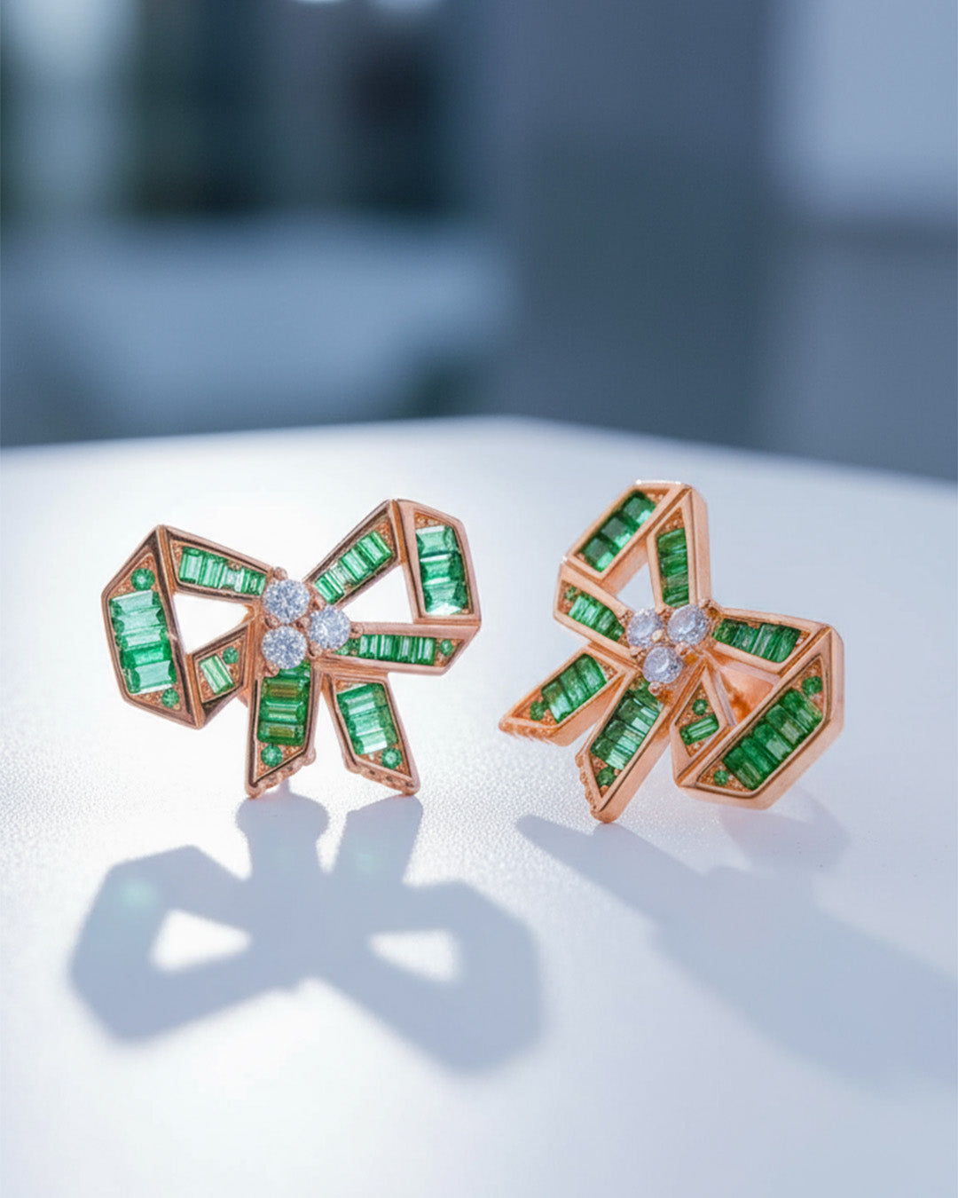rose gold and emerald CZ color bow shape stud earrings.