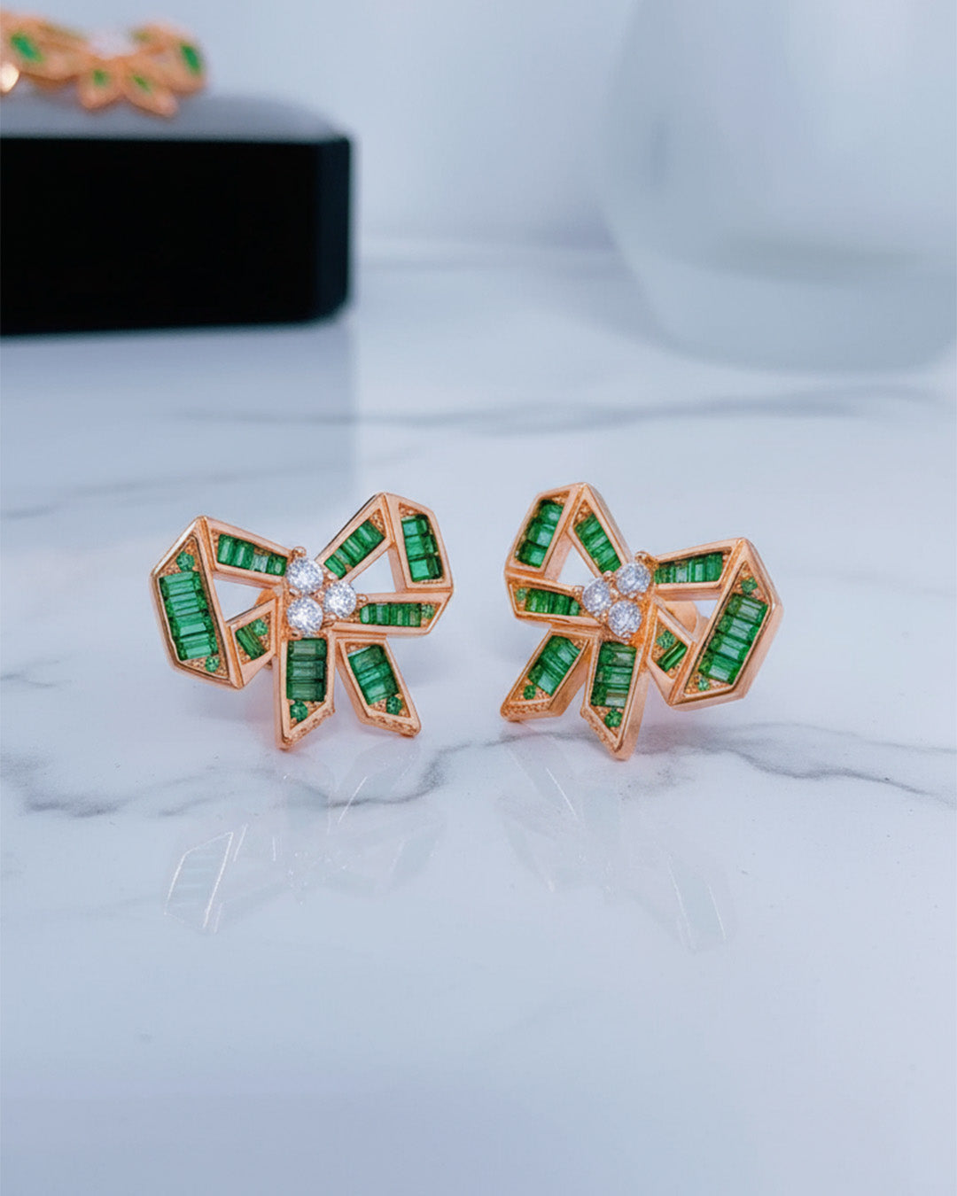 rose gold and emerald CZ color bow shape stud earrings.
