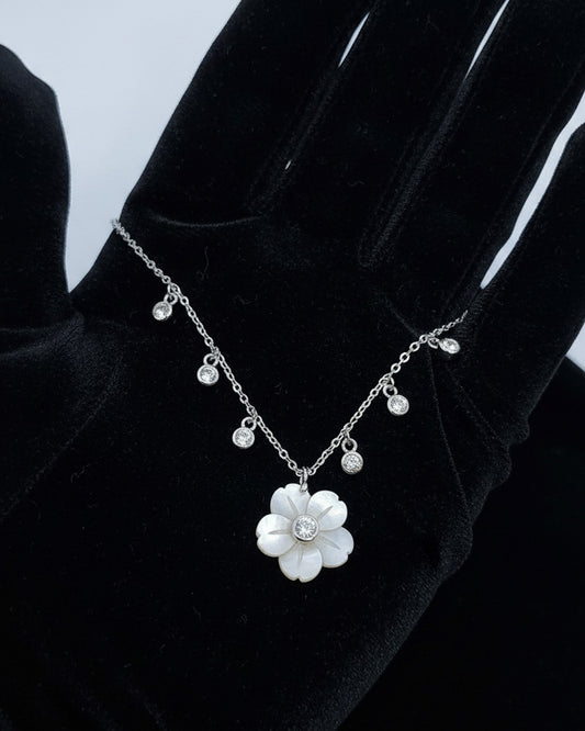 mother of pear flower shape necklace with dangling round CZ in bezel setting.