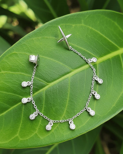 back to front X shape with dangling round CZ in Bezel setting earring.