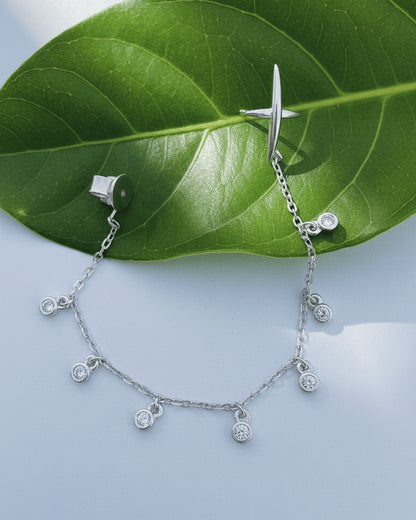 back to front X shape with dangling round CZ in Bezel setting earring.