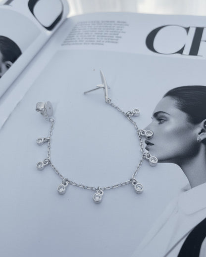 back to front X shape with dangling round CZ in Bezel setting earring.