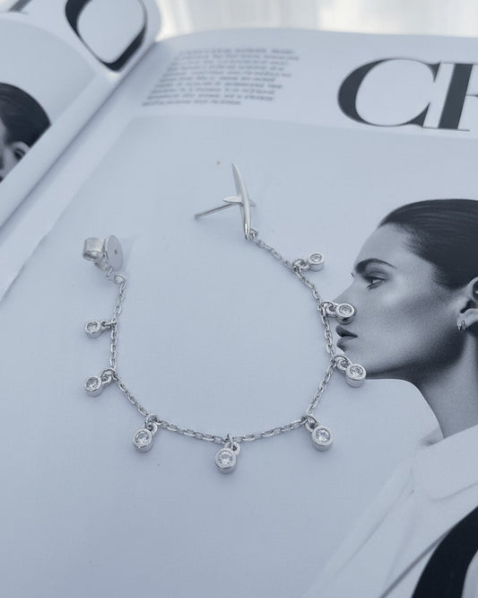 back to front X shape with dangling round CZ in Bezel setting earring.