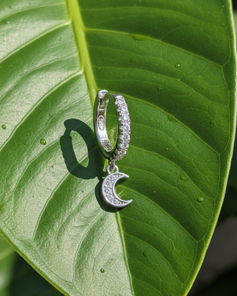 CZ huggie hoop with dangling small crescent shape.