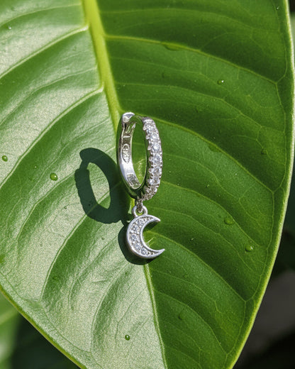 CZ huggie hoop with dangling small crescent shape.