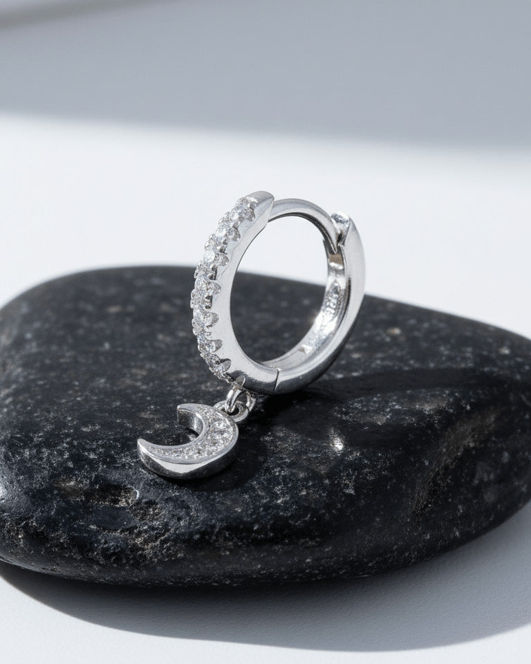 CZ huggie hoop with dangling small crescent shape.
