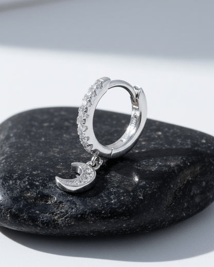 CZ huggie hoop with dangling small crescent shape.
