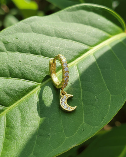 CZ huggie hoop with dangling small crescent shape.