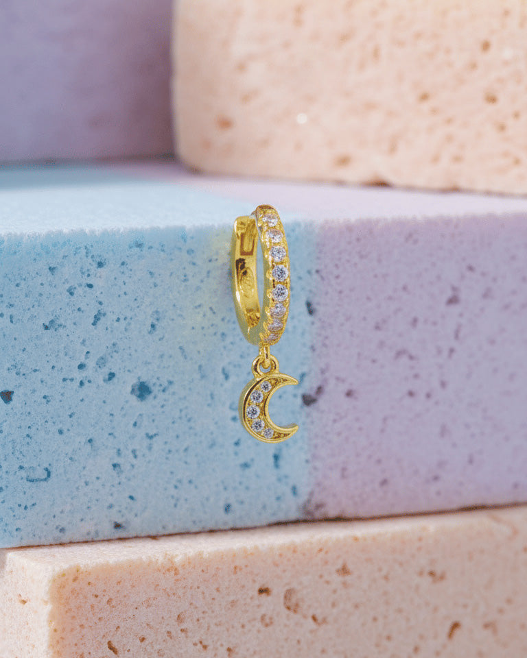 CZ huggie hoop with dangling small crescent shape.