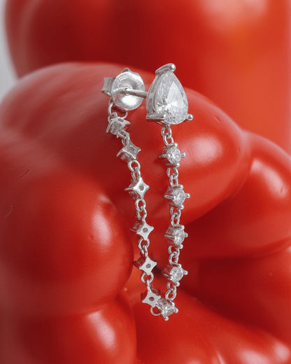 back to front pear shape stud with dangling CZ chain earring.