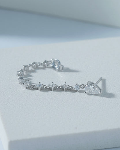 back to front pear shape stud with dangling CZ chain earring.