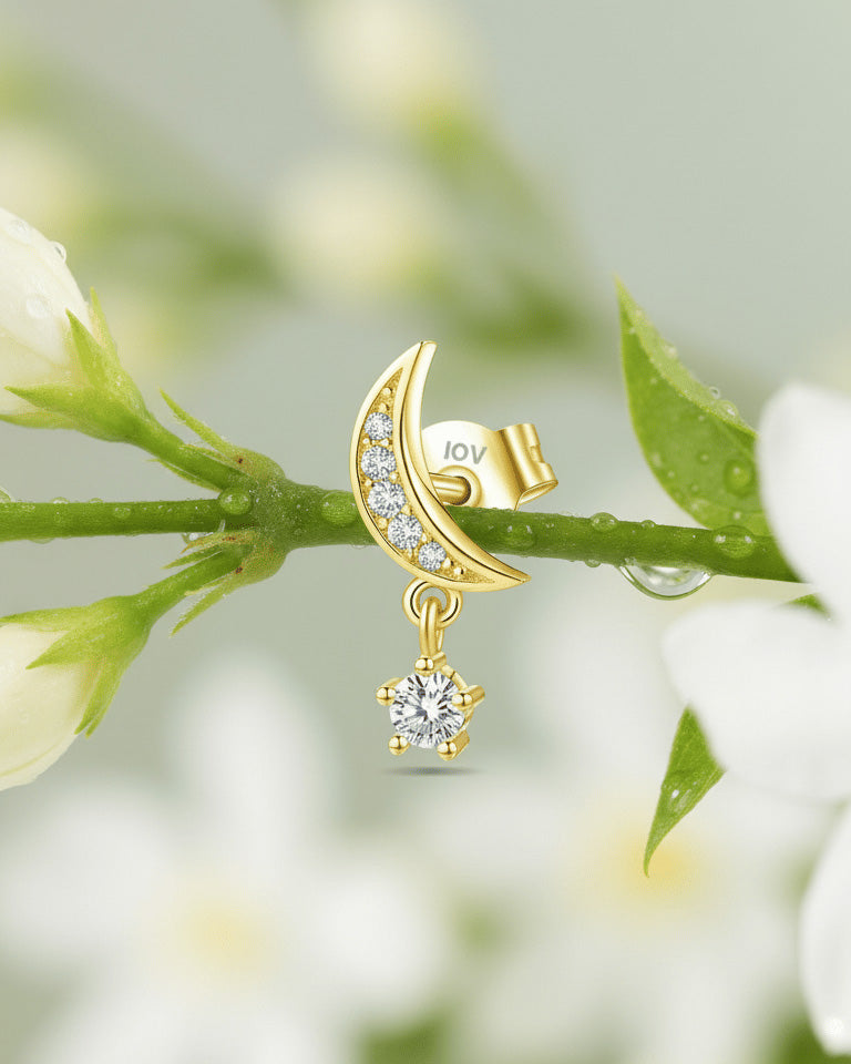 crescent shape with dangling round stone.