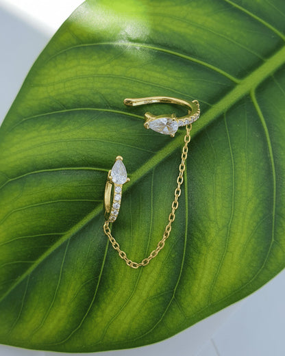 Pear and round shape huggie hoop linked with matching earcuff.