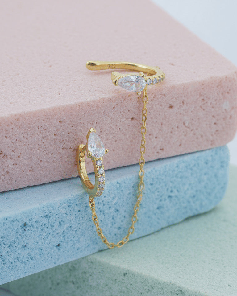 Pear and round shape huggie hoop linked with matching earcuff.