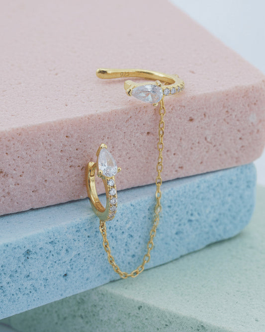 Pear and round shape huggie hoop linked with matching earcuff.