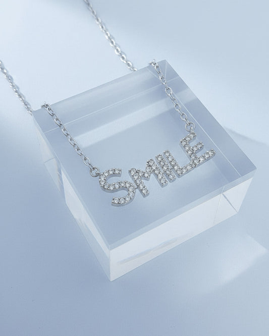 SMILE word necklace.