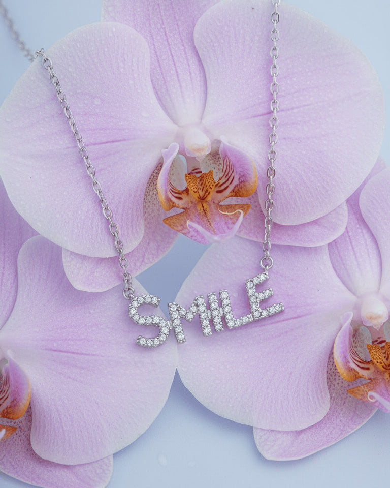 SMILE word necklace.