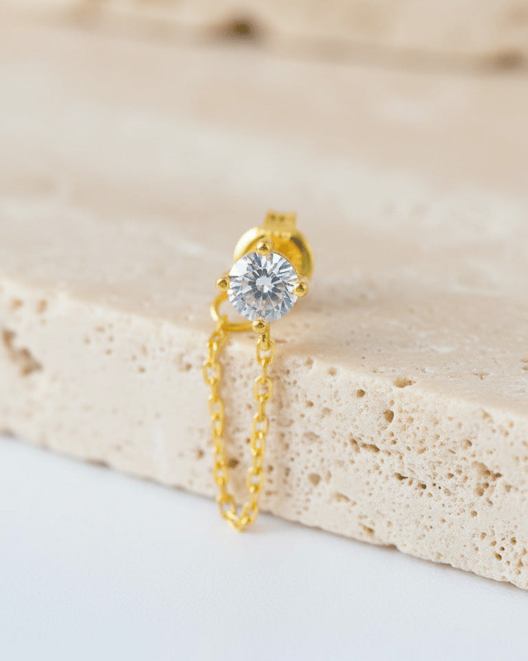 single stud CZ stone with back dangling chain.