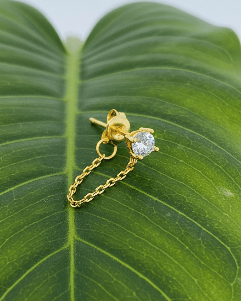 single stud CZ stone with back dangling chain.