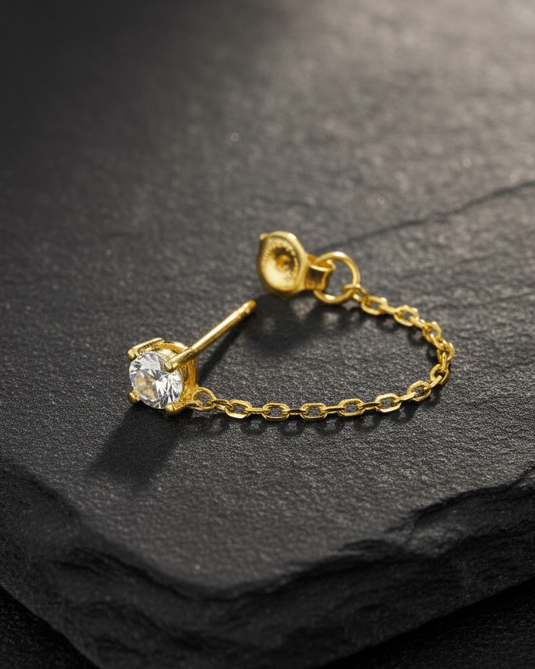 single stud CZ stone with back dangling chain.
