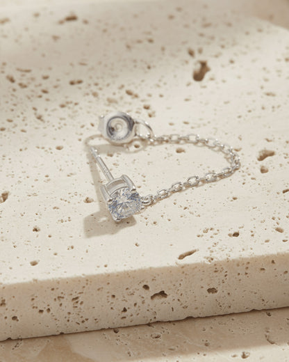 single stud CZ stone with back dangling chain.