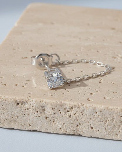 single stud CZ stone with back dangling chain.