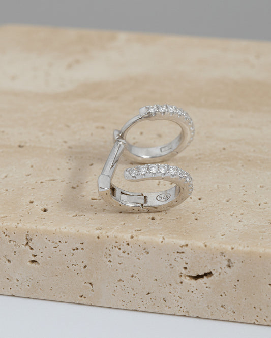 doucble huggie hoops of one piercing earring.
