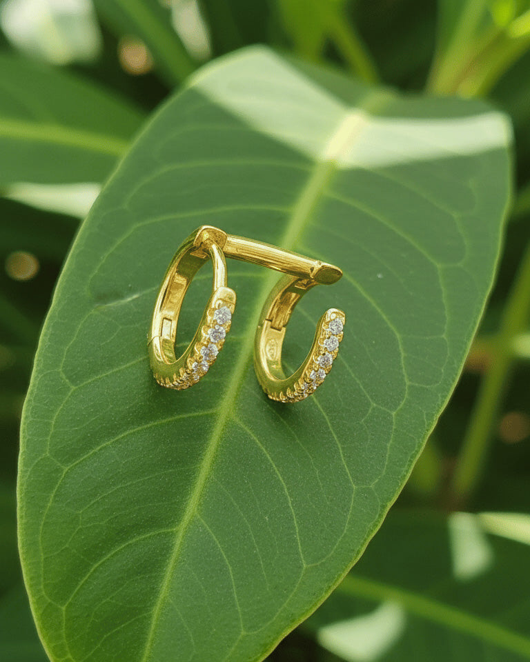 doucble huggie hoops of one piercing earring.