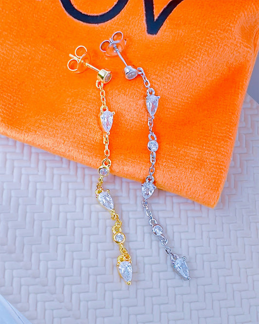 CZ long earring with round and pear shape stones.