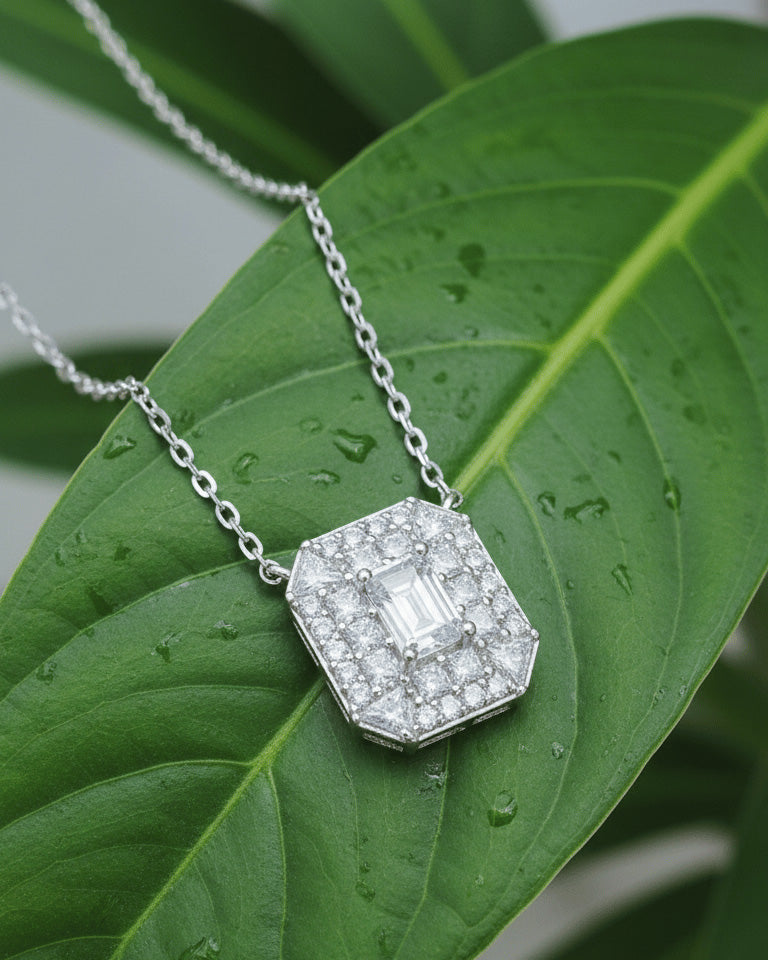 rectangular shape necklace with emerald cut CZ stone in center.
