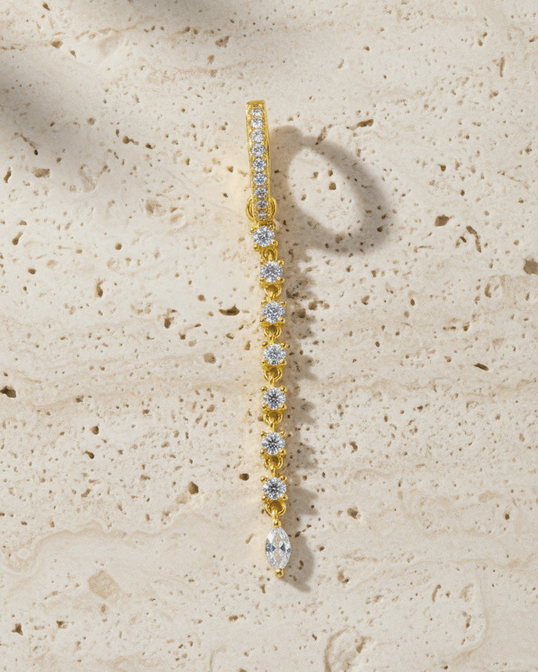 CZ huggie hoop earring with detachable line of links studded with round stones.