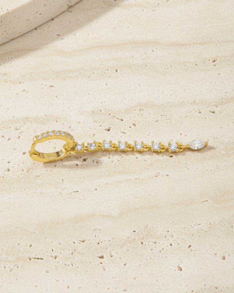 CZ huggie hoop earring with detachable line of links studded with round stones.