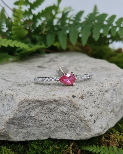 curved CZ line with pear colored stone stud earring.