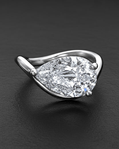 wavy shape ring with pear shape.
