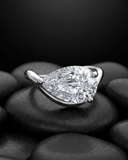 wavy shape ring with pear shape.