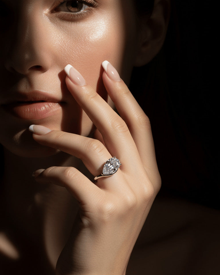 wavy shape ring with pear shape.