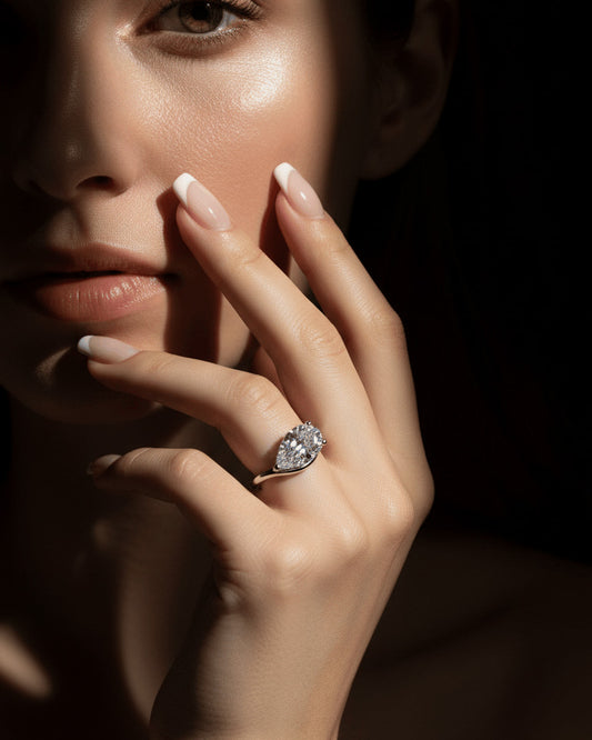 wavy shape ring with pear shape.