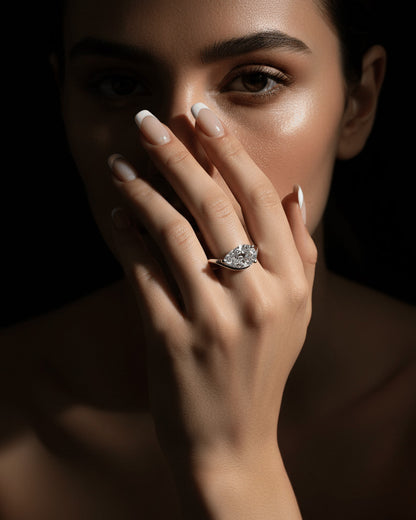 wavy shape ring with pear shape.