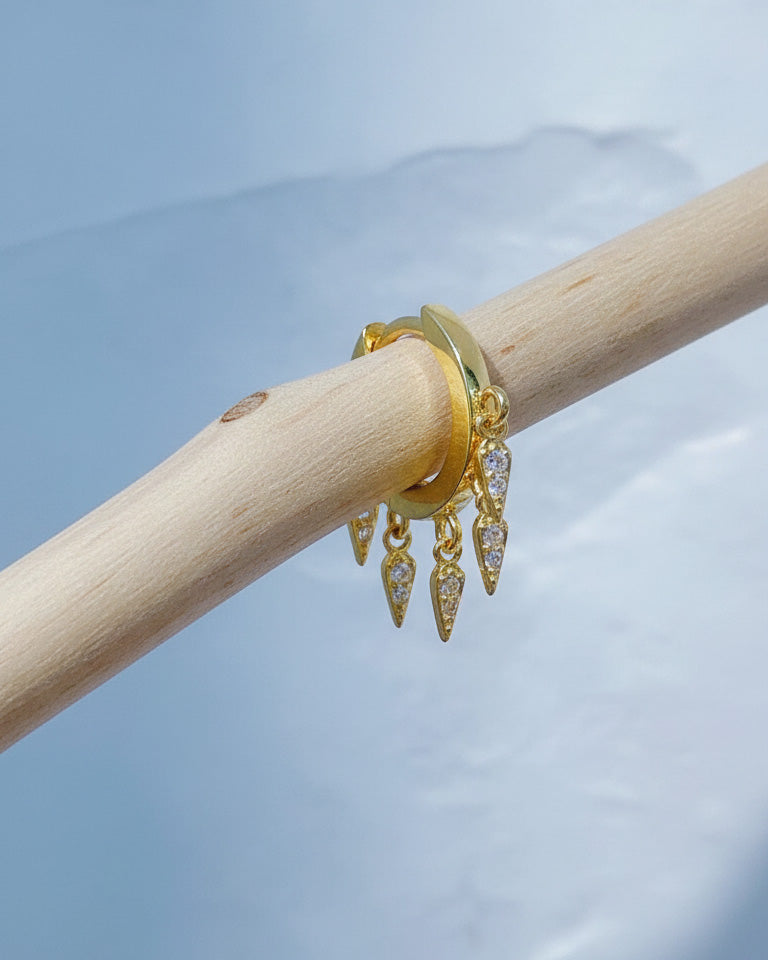 plain huggie hoop with dangling CZ kite shape earring.