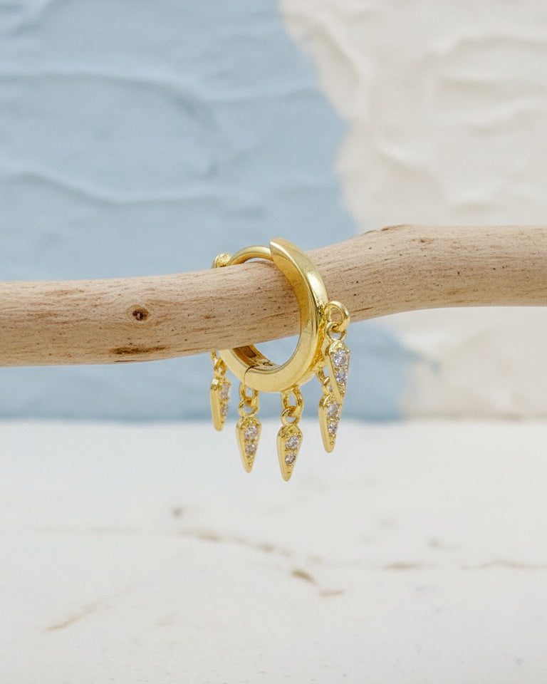 plain huggie hoop with dangling CZ kite shape earring.