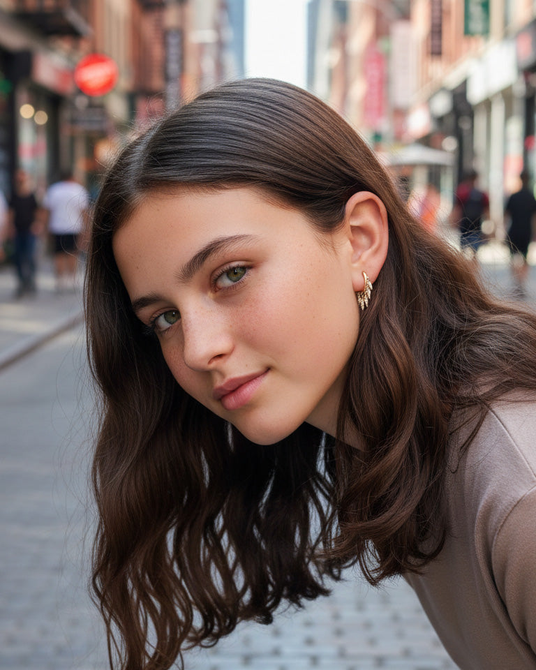 plain huggie hoop with dangling CZ kite shape earring.