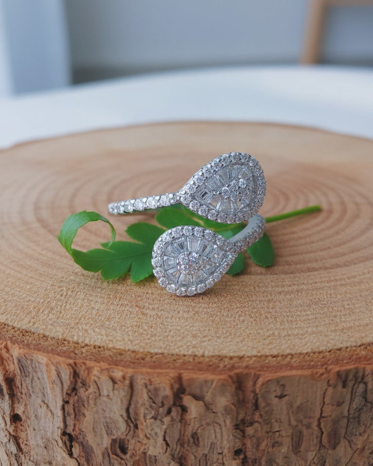 pear shape open ring with trapezoid and round CZ.